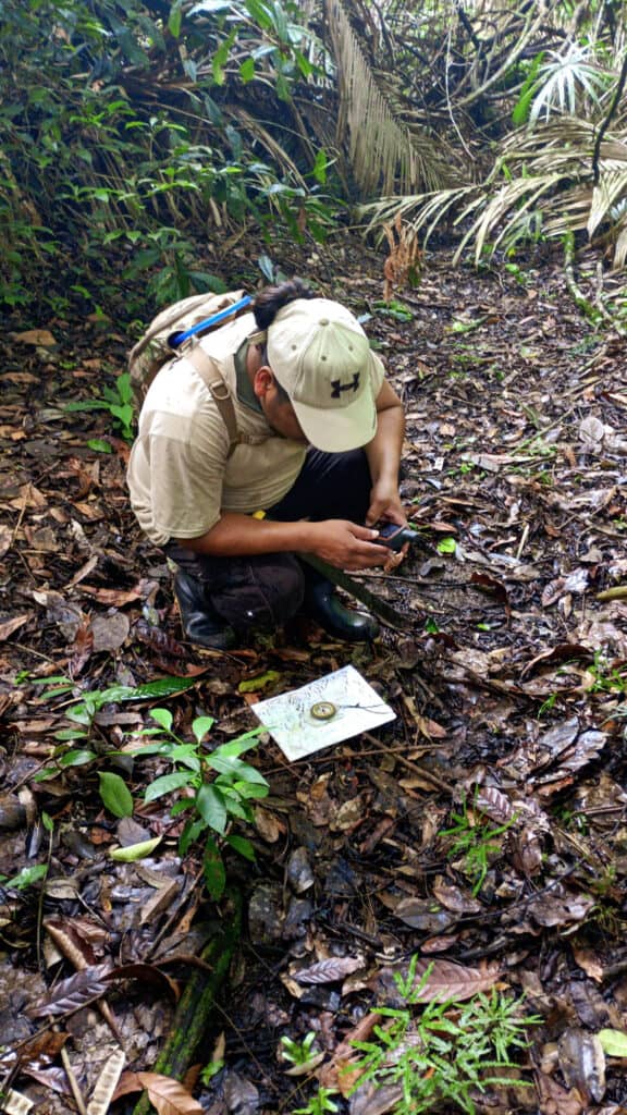 BKHC Ranger using a variety of navigation tools to survey Tapir Mountain Nature Reserve